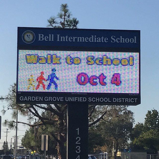 Our electric sign promotes Walk to School Day! Did you get the memo?