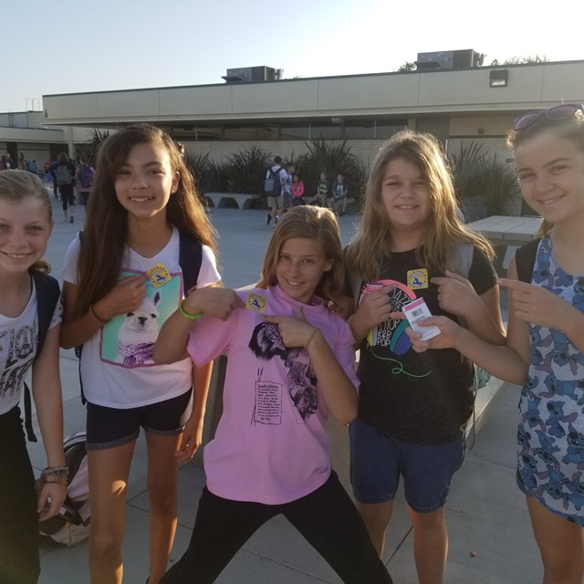 These five lovely ladies show off their school spirit with Roadrunner stickers!