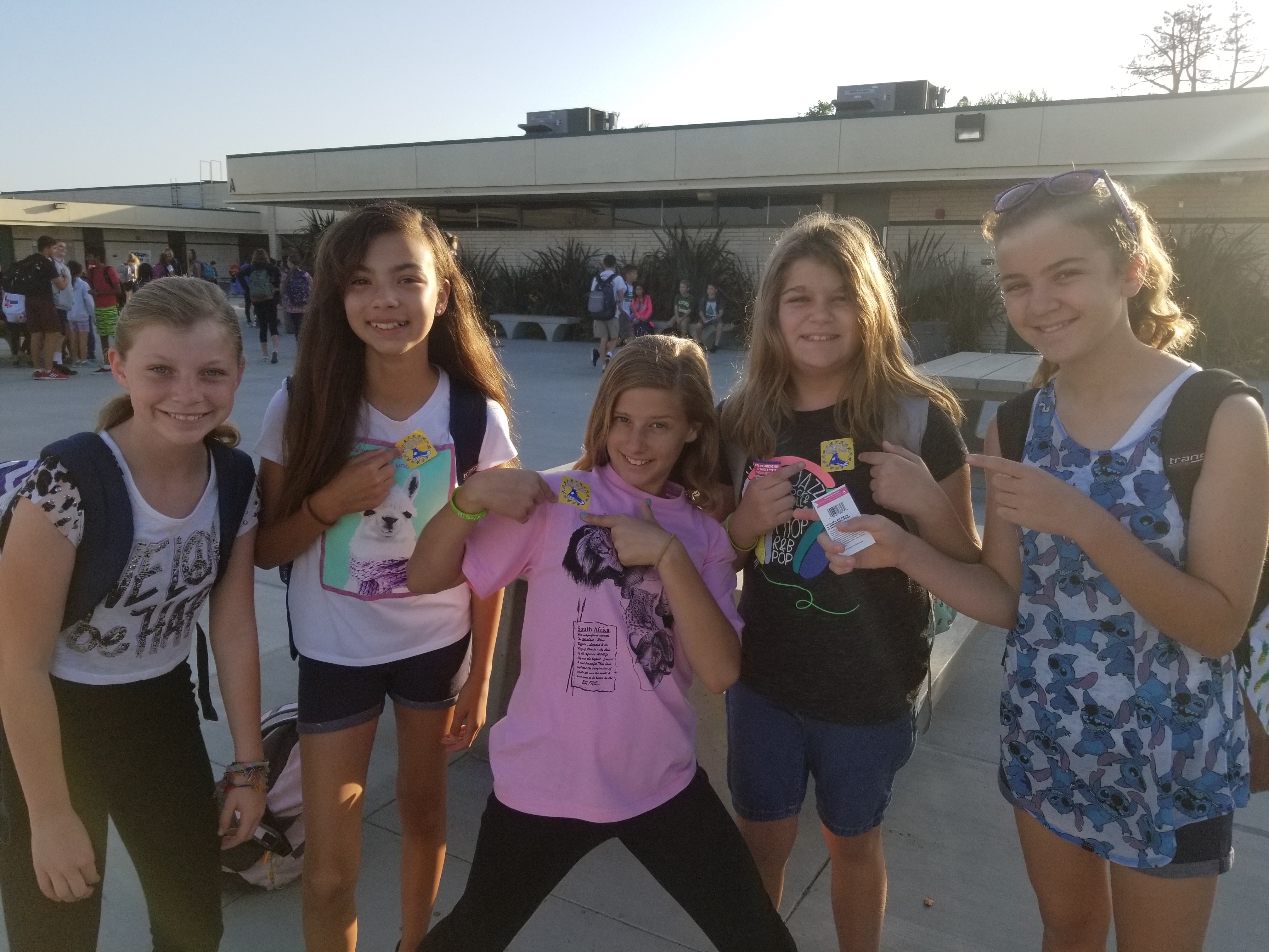 These five lovely ladies show off their school spirit with Roadrunner stickers!