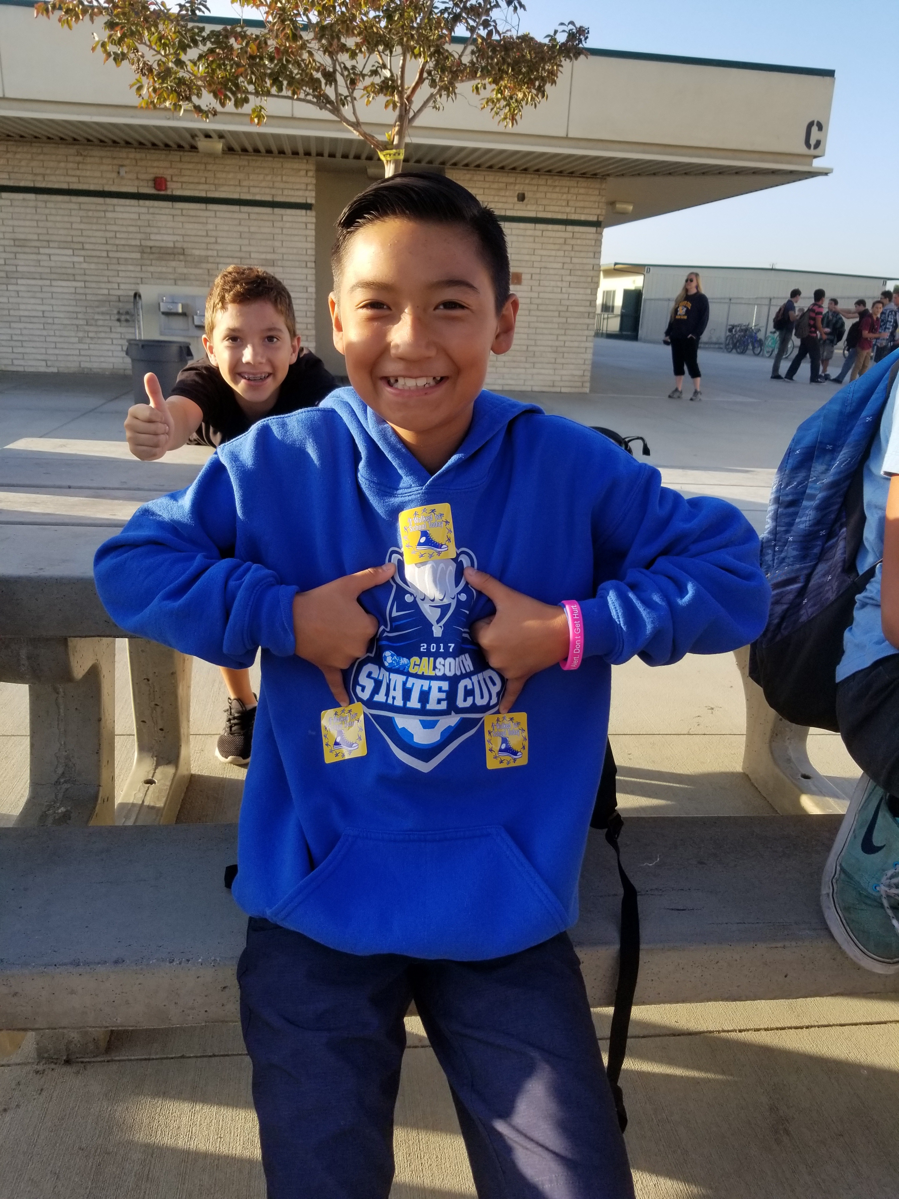 This young gentleman models Roadrunner pride! His friend approves!