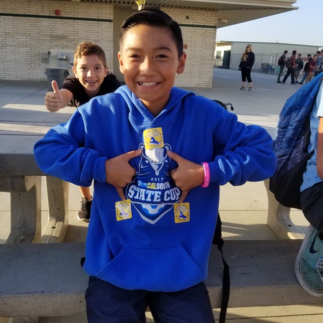 This young gentleman models Roadrunner pride! His friend approves!