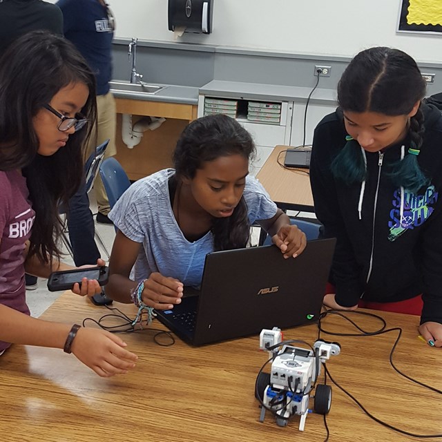 These young ladies work as a team to finish up their stem lab. Three minds are better than one!
