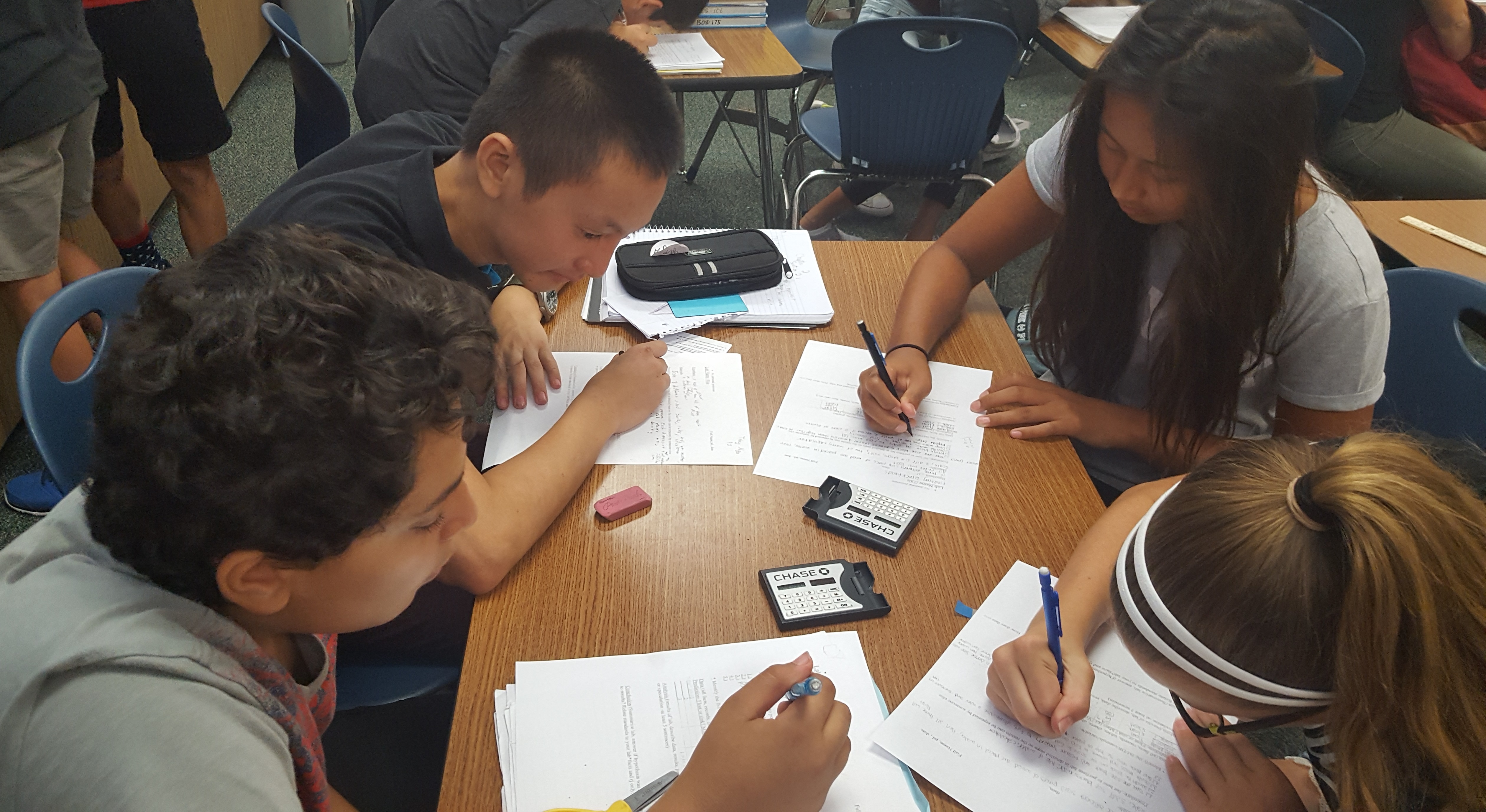 Students engage in their density lab. Time to embrace the sciences!